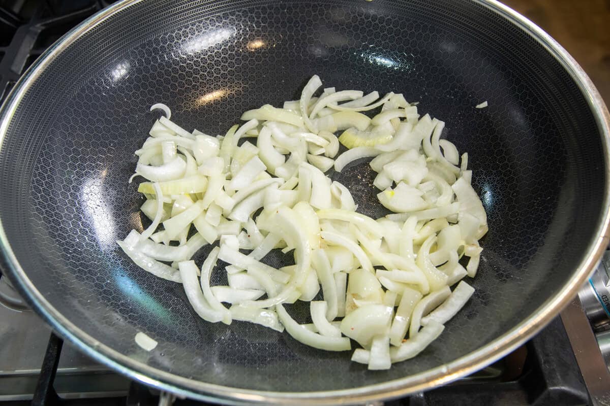 sliced onions in a skillet