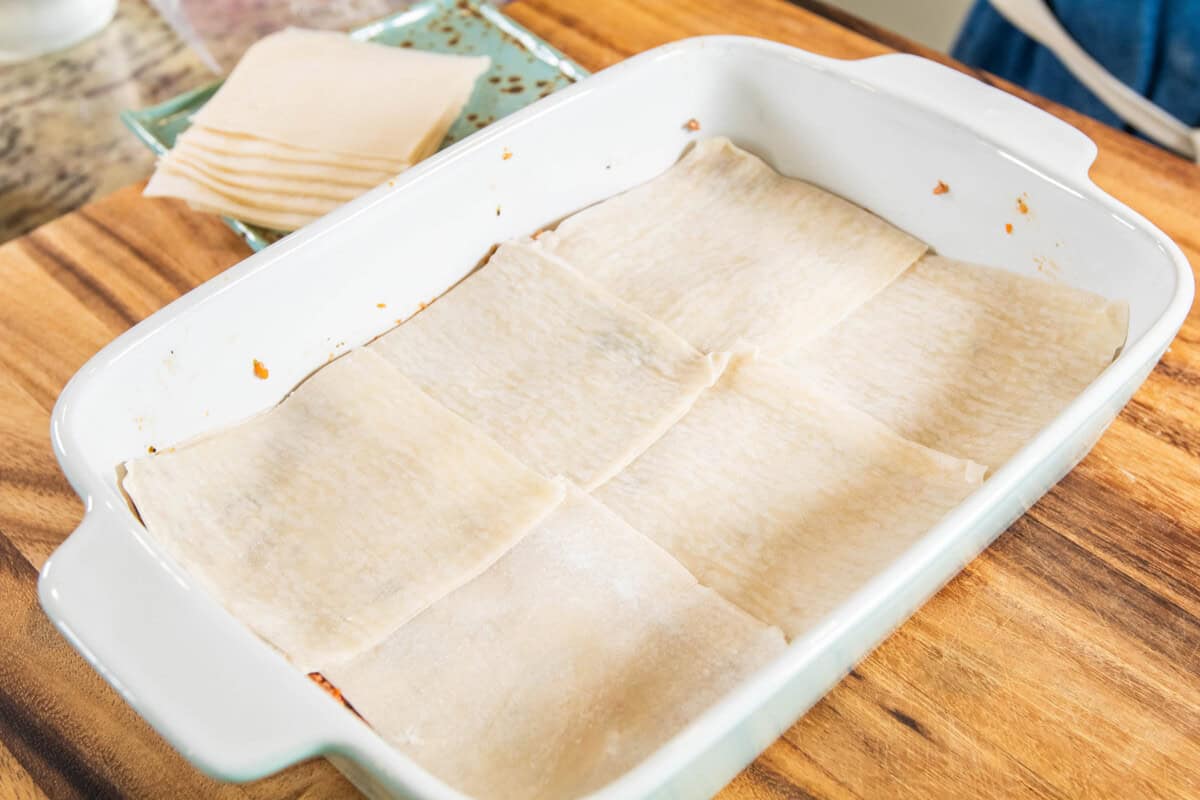 layer of dumpling wrappers in baking dish