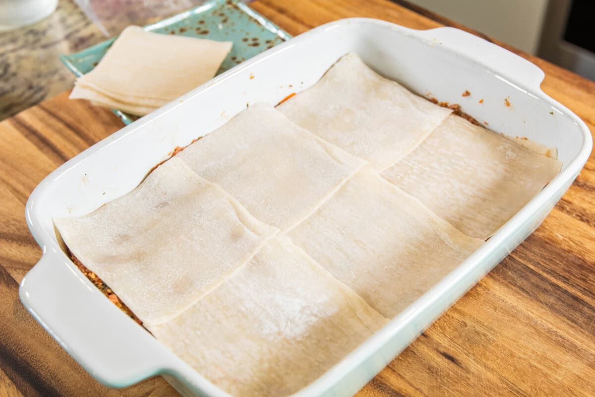 layer of dumpling wrappers in baking dish