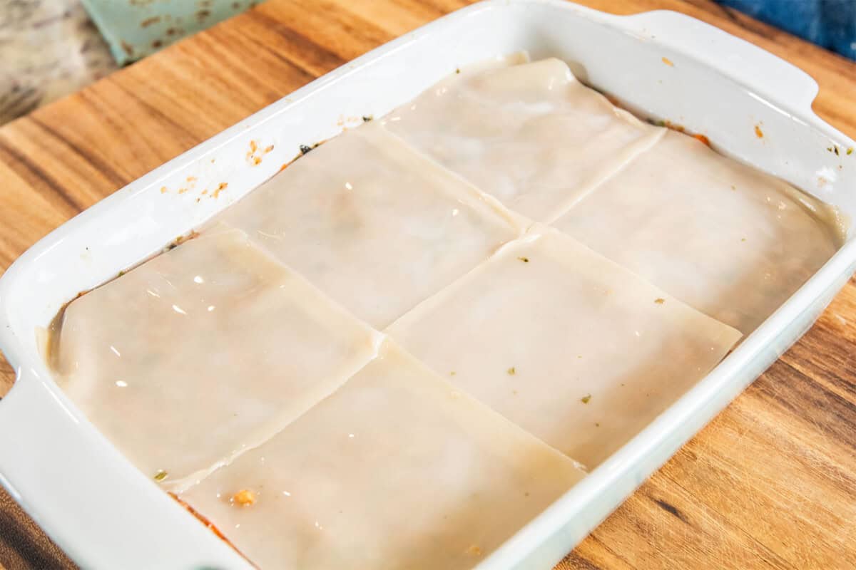 add water to top layer of dumpling lasagna