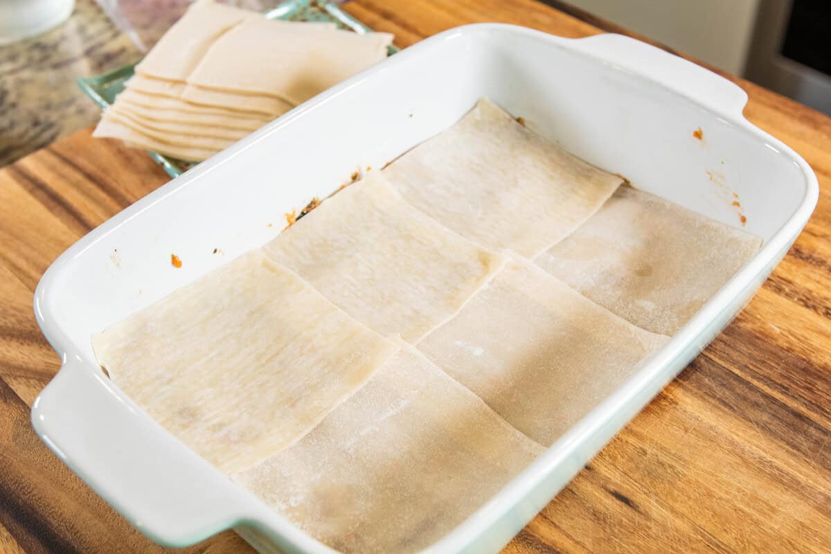 layer of dumpling wrappers In baking dish