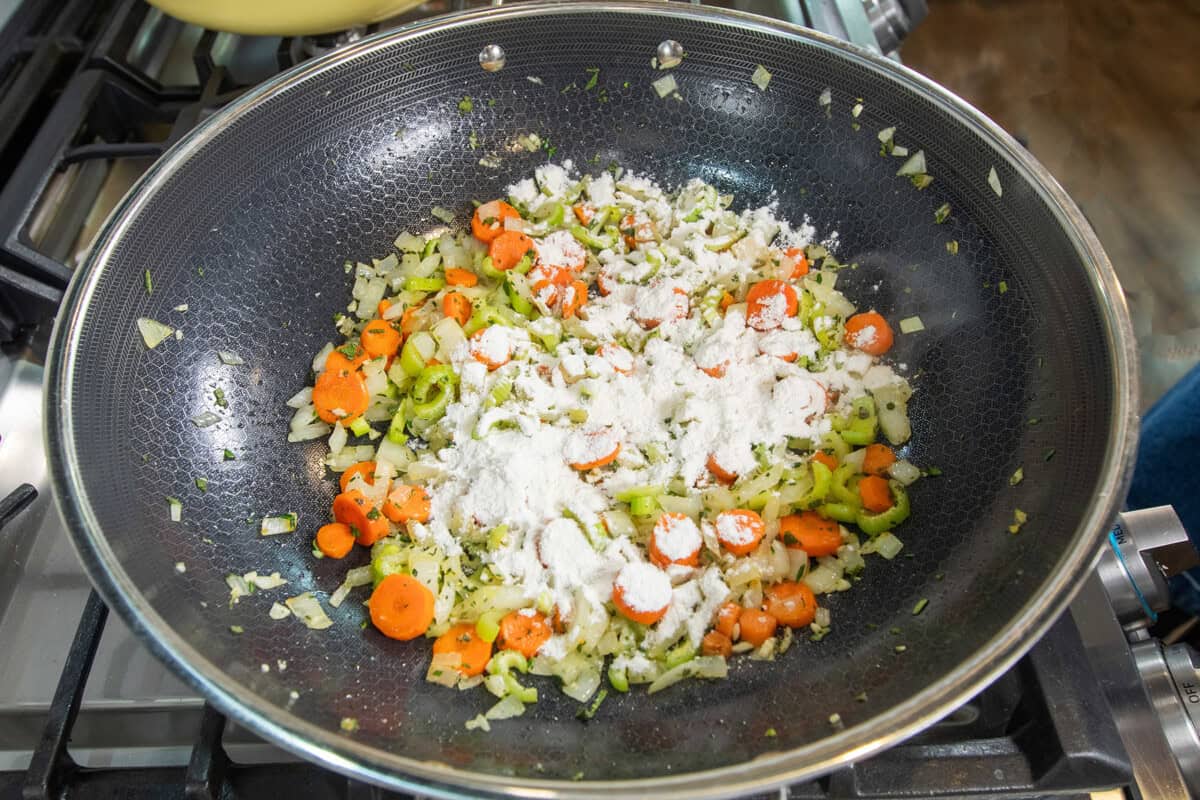 adding flour on top of the veggies