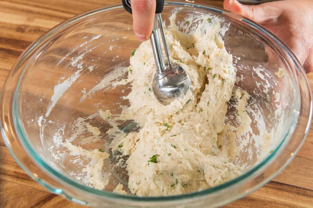 scooping drop biscuits out of bowl