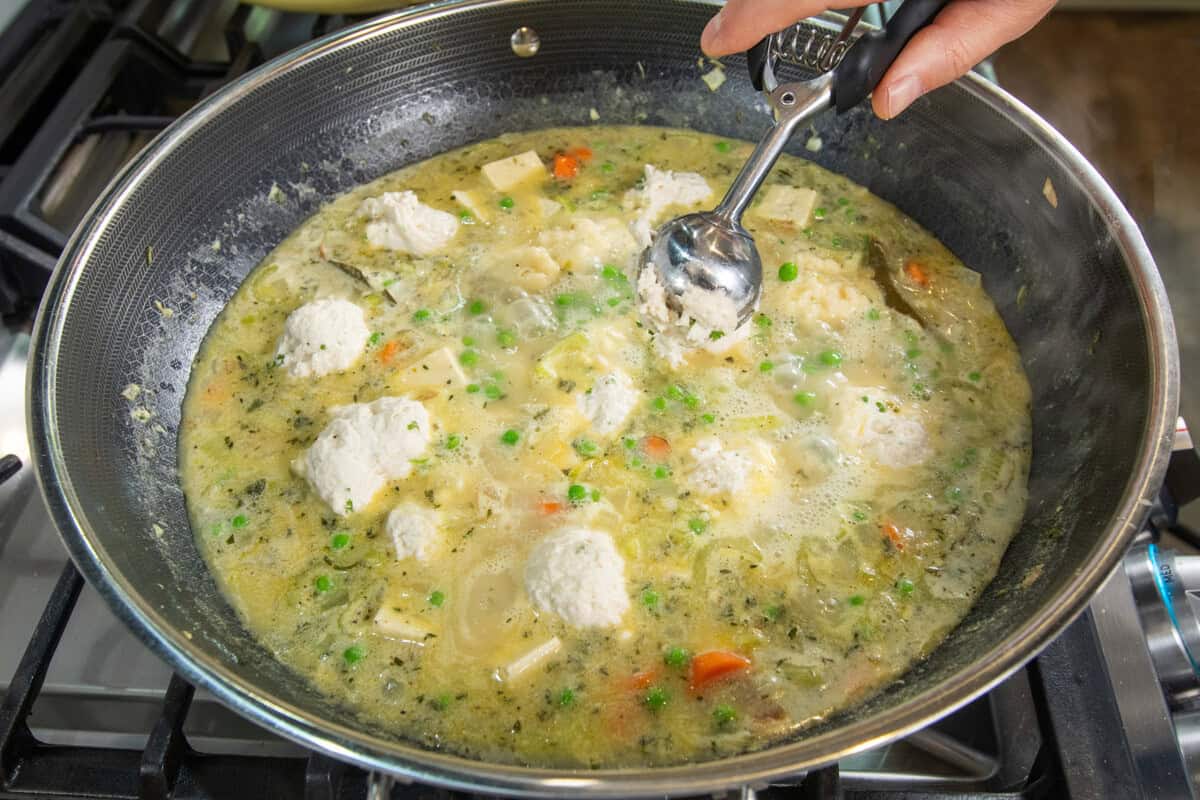 dropping dumplings into pot
