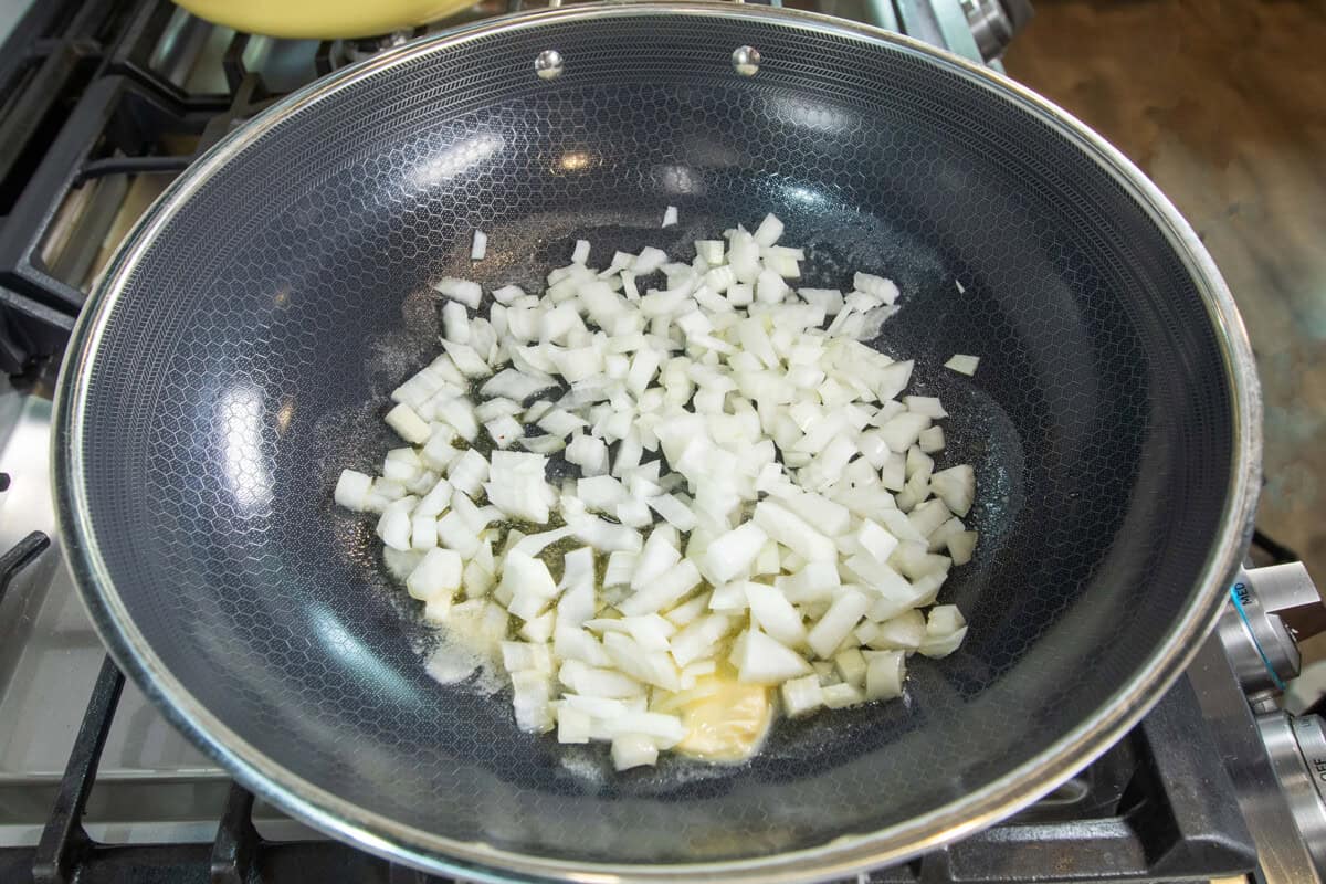 adding onions to the pot