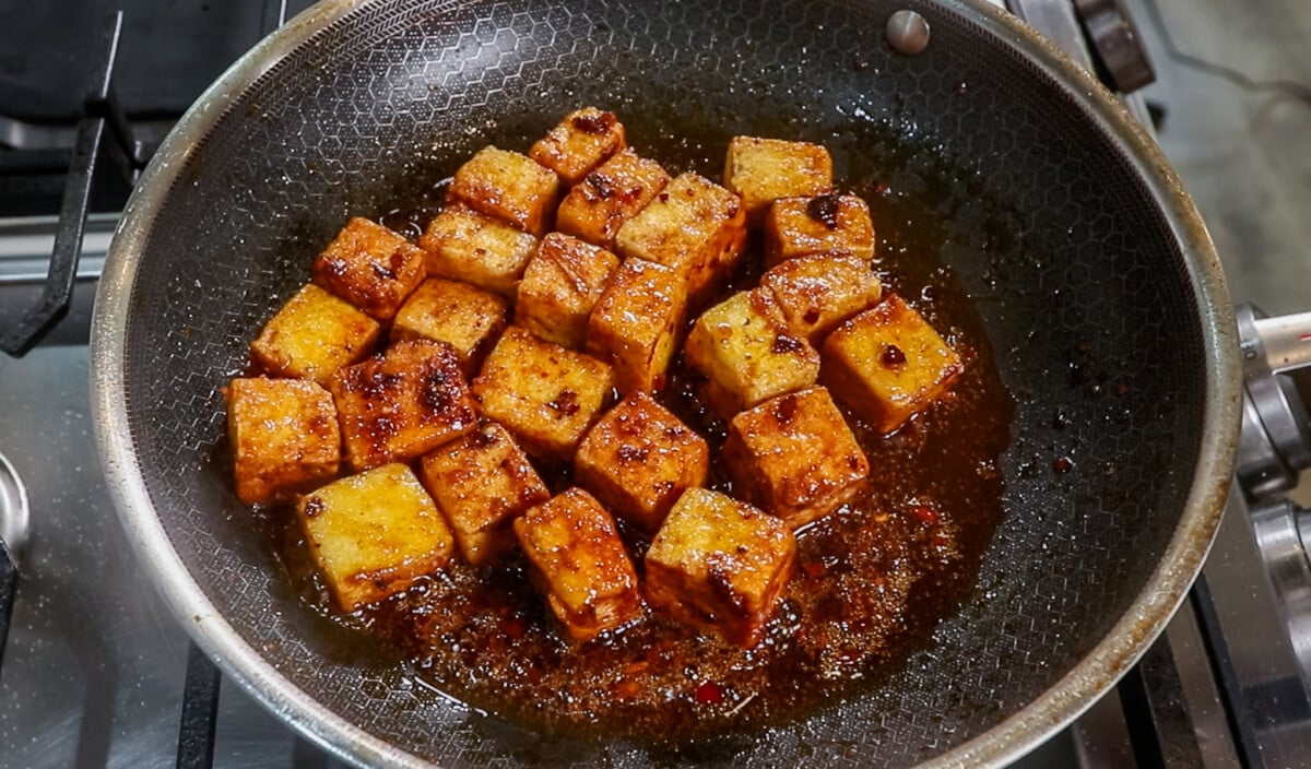finished Chili Crisp Tofu cubes in pan