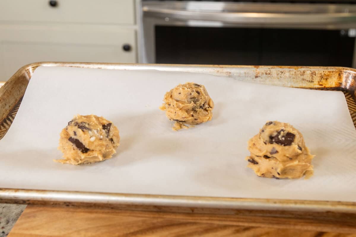 cookie dough on a lined baking sheet