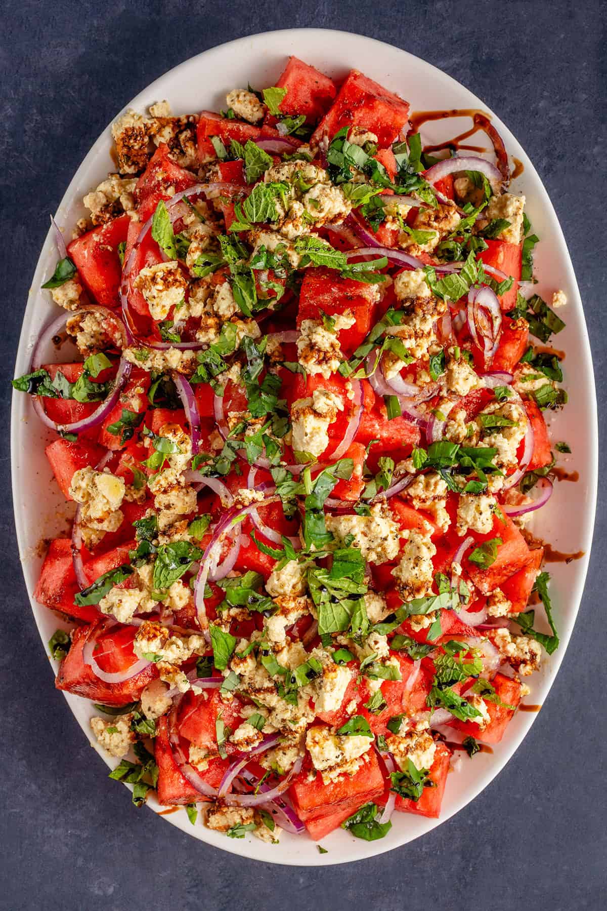 overhead of tofu feta watermelon salad on platter