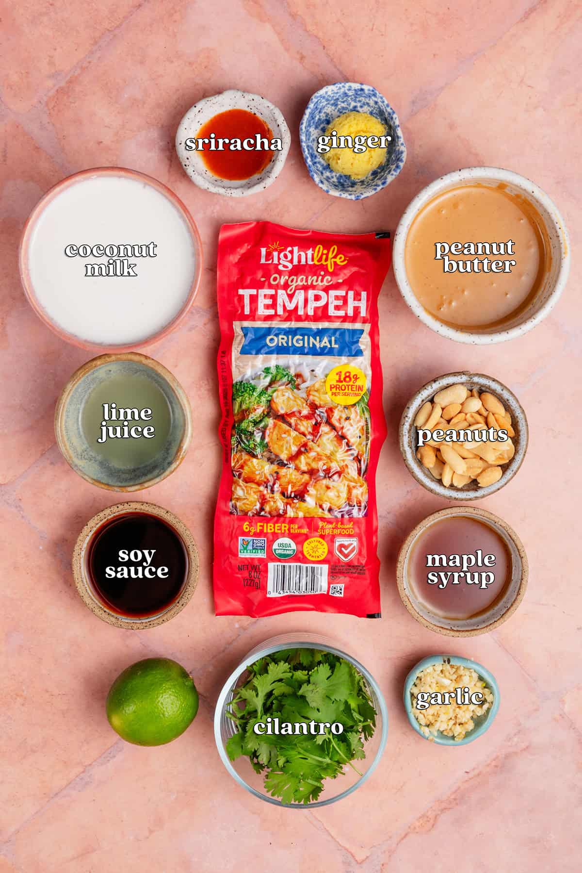 sriracha, ginger, coconut milk, tempeh, peanut butter, lime juice, peanuts, soy sauce, maple syrup, cilantro, garlic