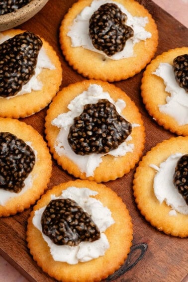vegan chia seed caviar on crackers with cream cheese