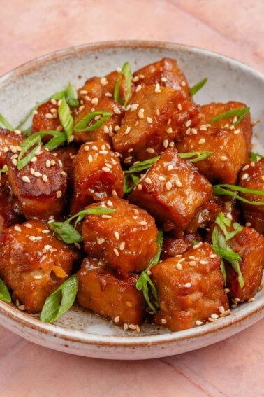 miso maple braised tempeh topped with sesame seeds and scallions