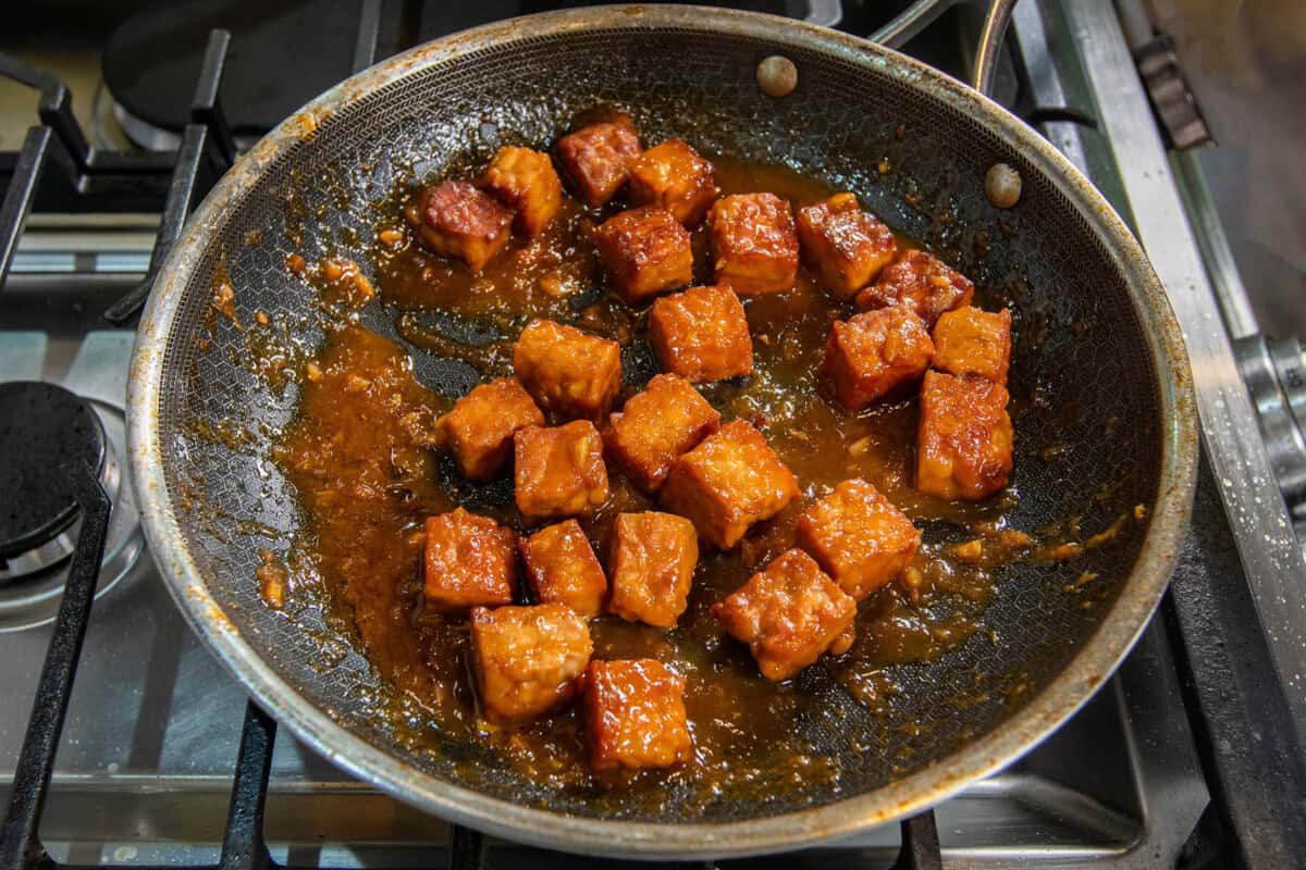 miso maple braised tempeh in a skillet