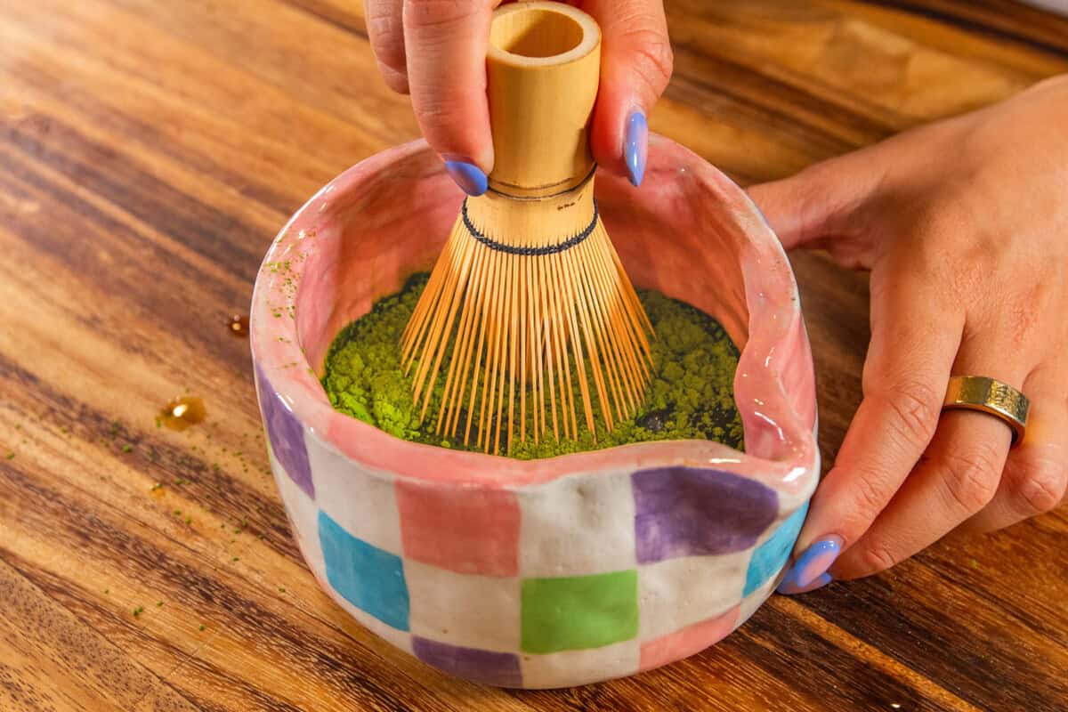 whisking matcha in matcha bowl