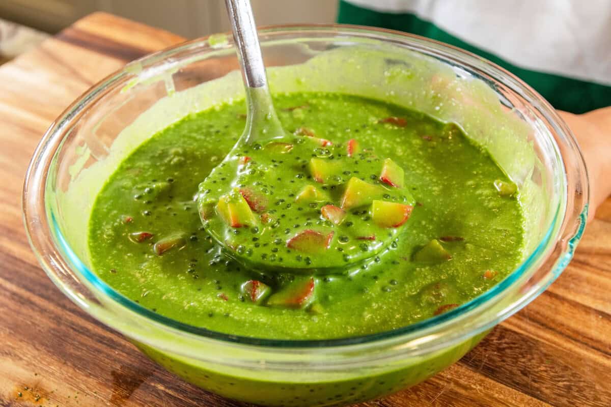 scooping the strawberry matcha sago with a ladle from a large bowl