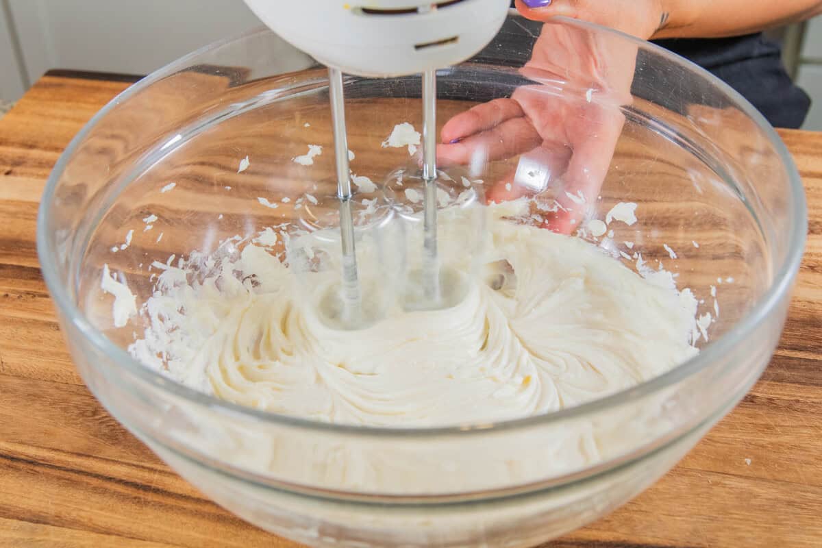 whipping vegan heavy cream in a bowl