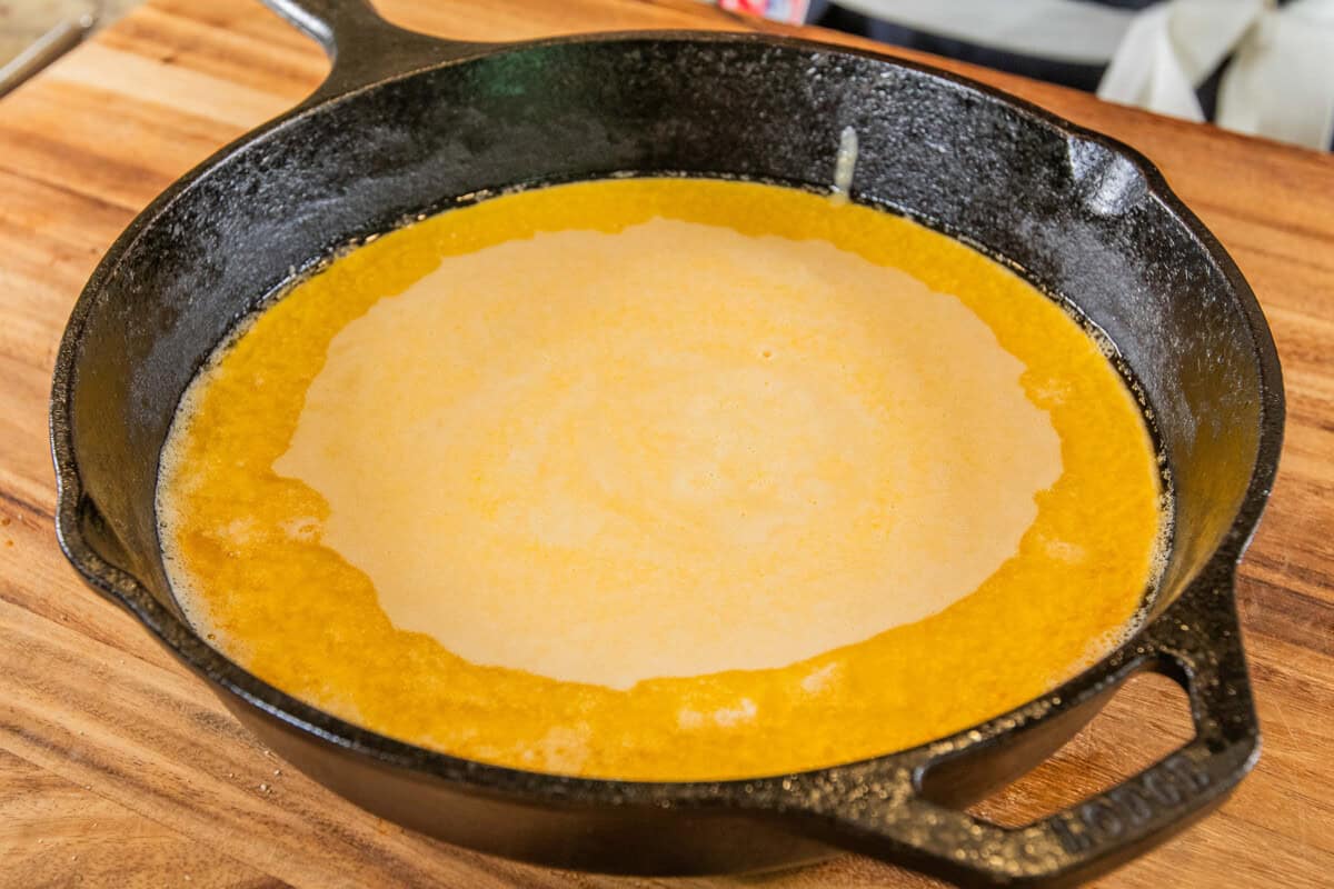 batter in the skillet with melted butter