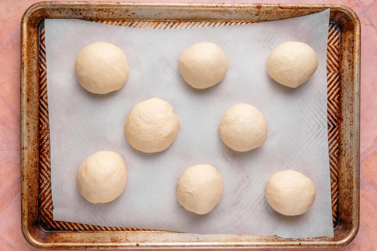 dough balls for Olive Chive Cream Cheese Rolls before second rise on baking sheet