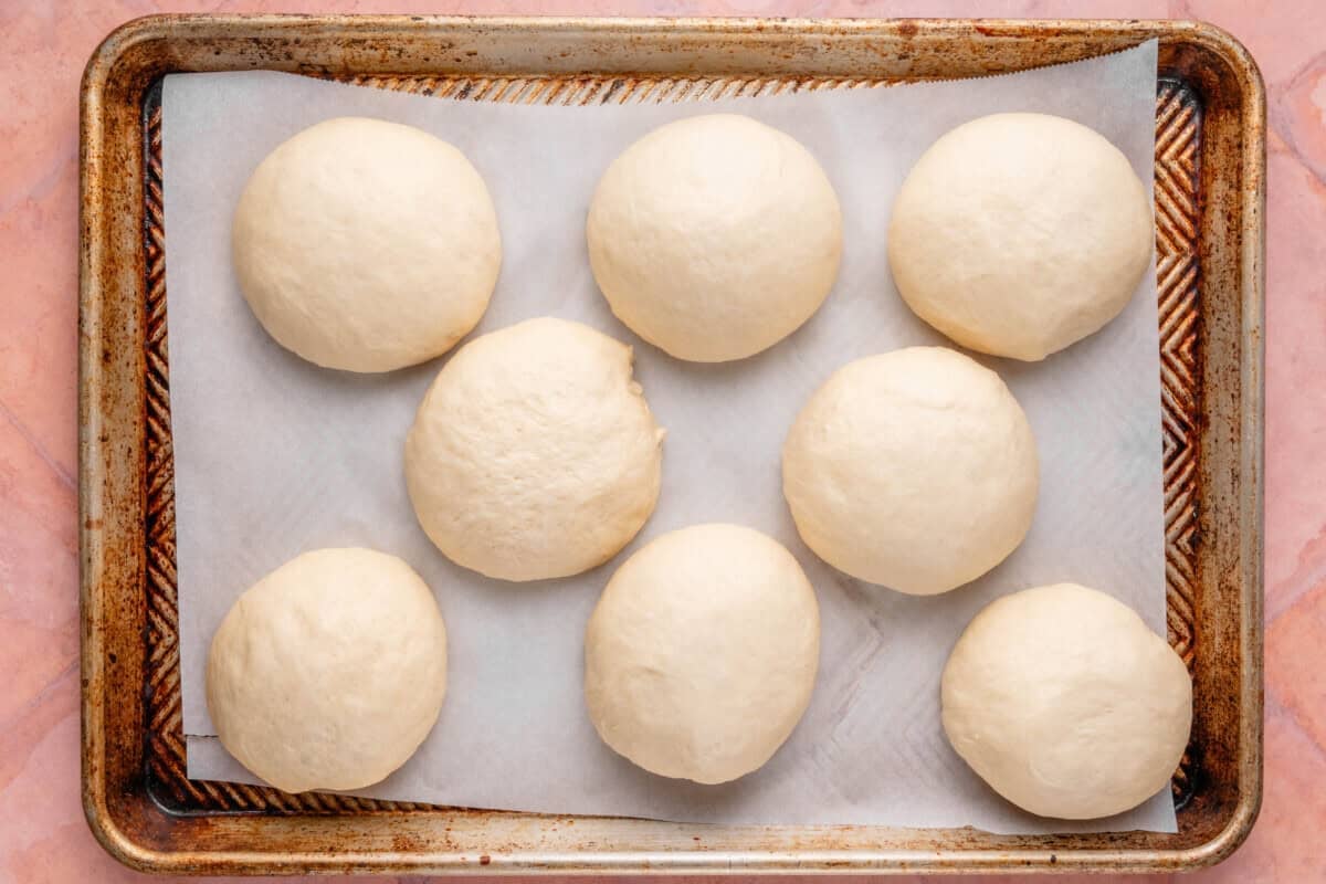 dough balls for Olive Chive Cream Cheese Rolls after second rise on baking sheet