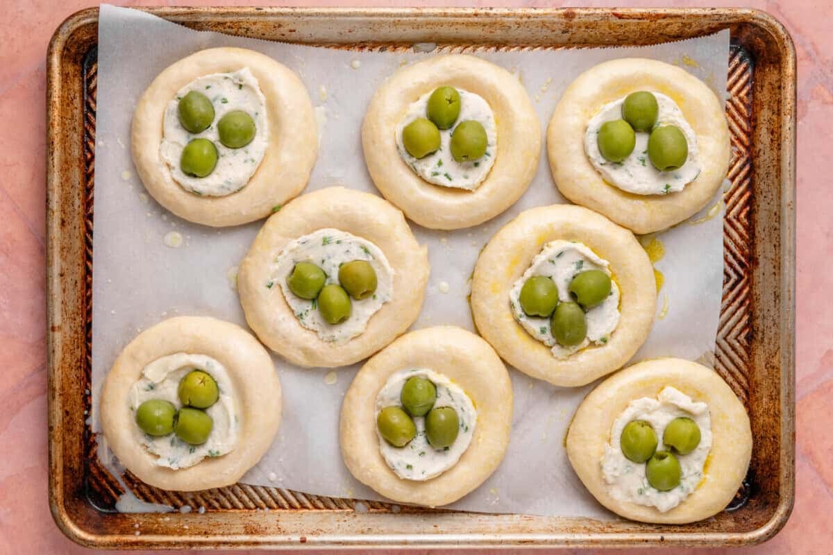 unbaked Olive Chive Cream Cheese Rolls on baking sheet