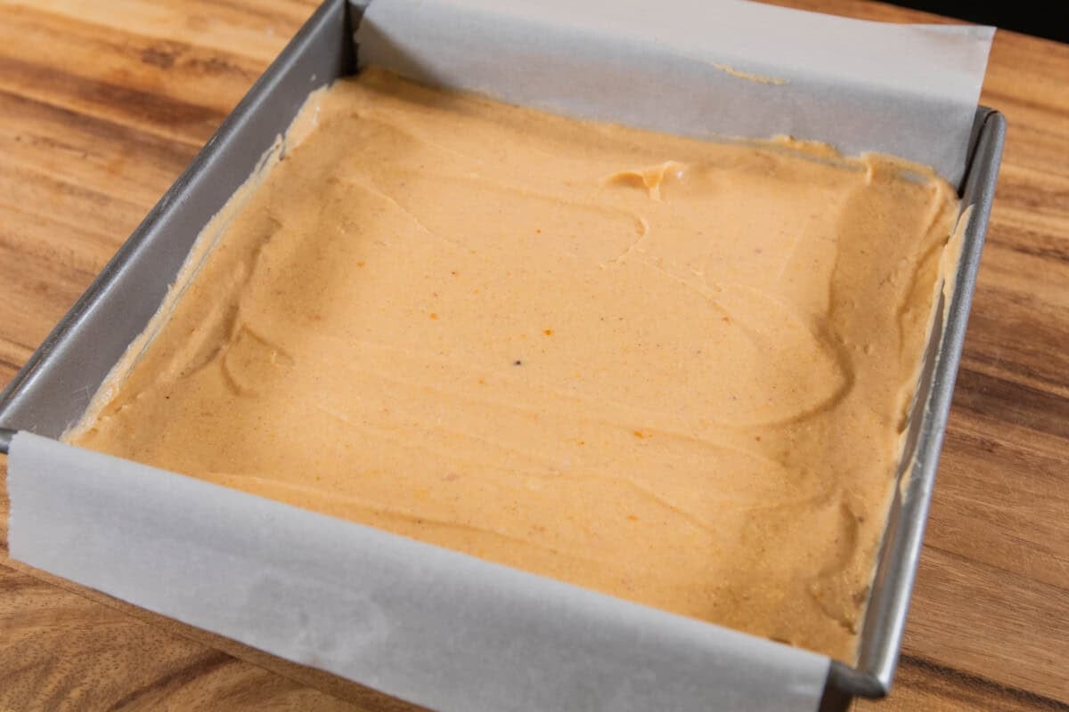 creamy pumpkin filling for pumpkin cheesecake bars in baking dish