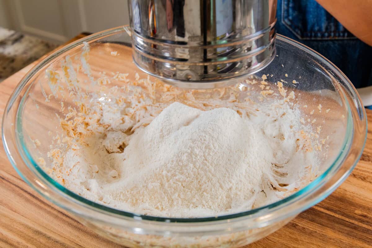 sifted flour added to the whipped butter and sugar