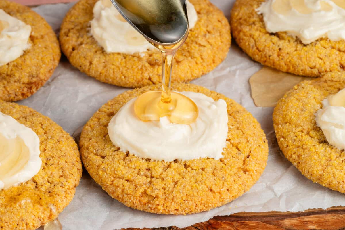 drizzling agave on top of frosted cornbread cookies