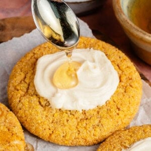 vegan cornbread cookies with agave buttercream and a drizzle of agave on top