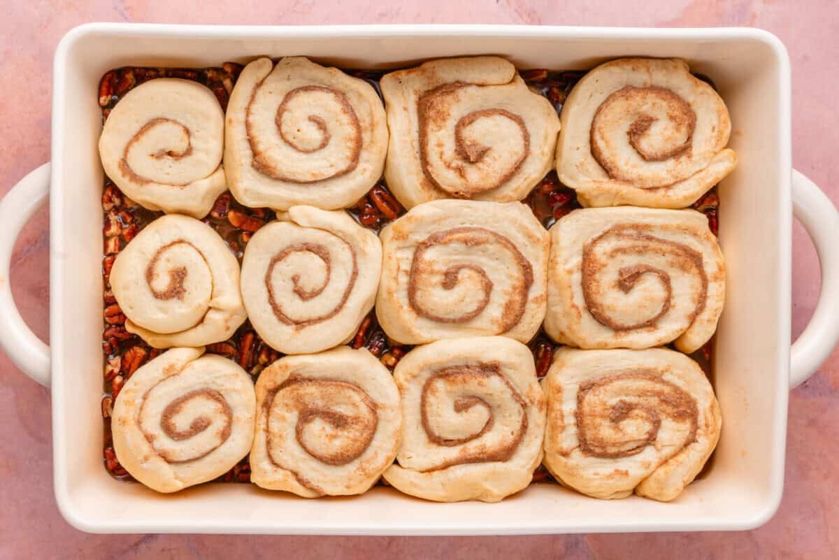 sliced rolls in the baking dish before rising