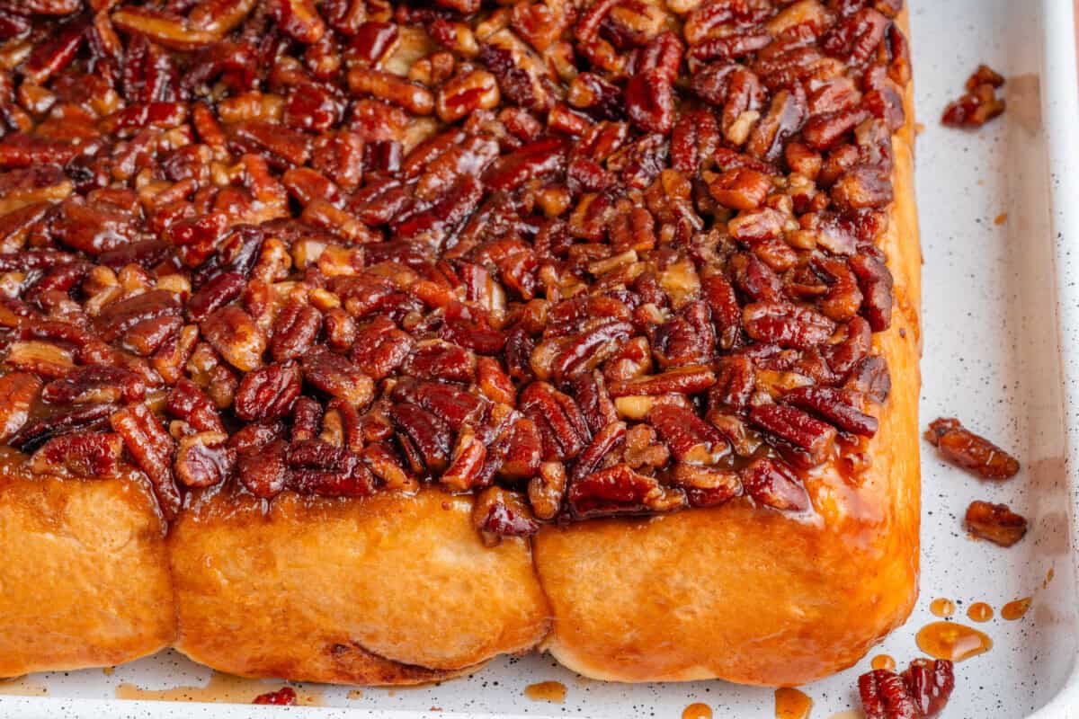 close up of maple pecan sticky buns in a sheet pan