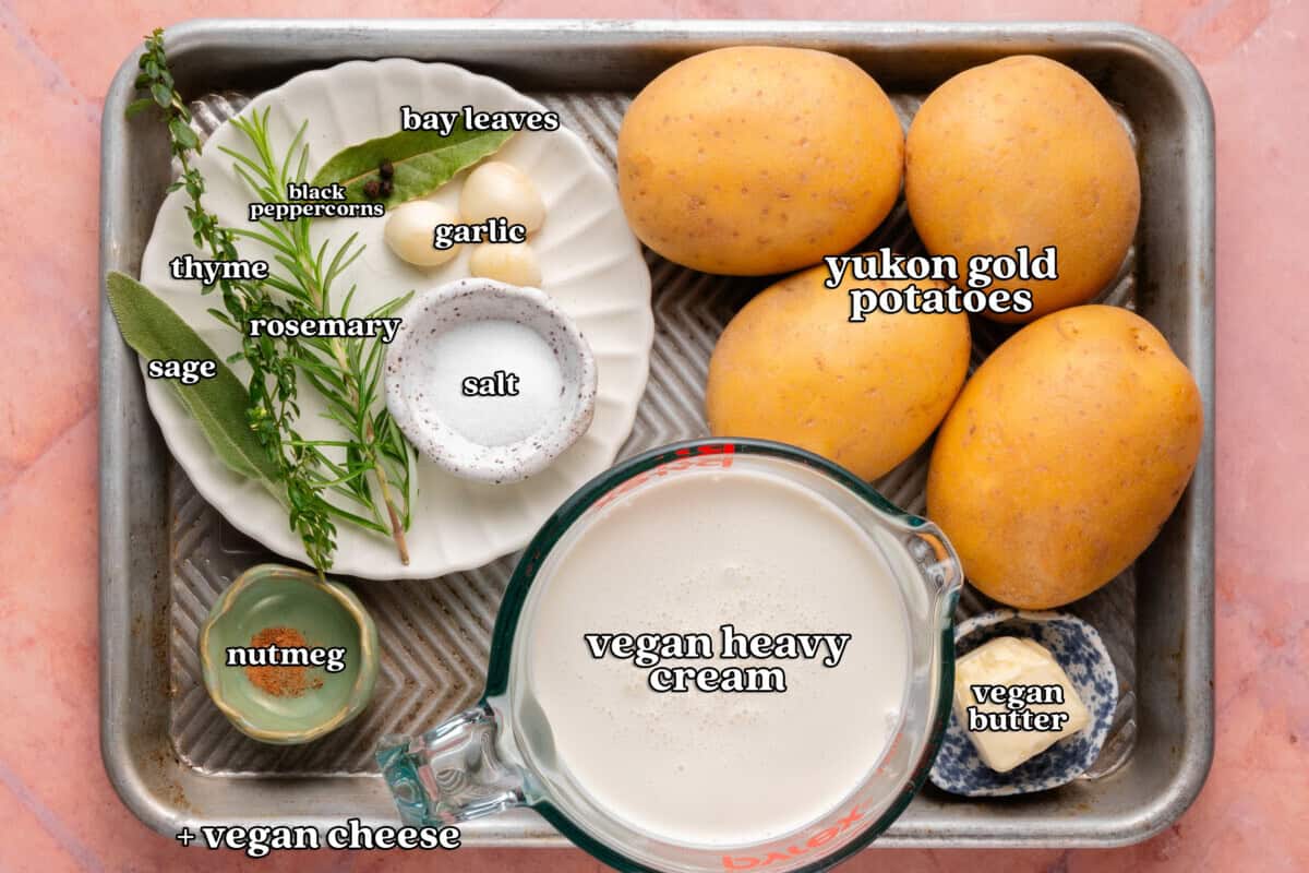 sage, thyme, black peppercorns, bay leaves, garlic, salt, rosemary, nutmeg, yukon gold potatoes, heavy cream, vegan butter, + vegan cheese